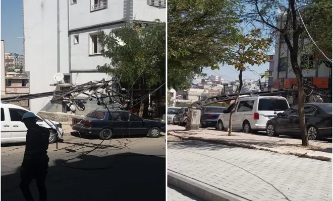 Elektrik direği arabanın üstüne düştü