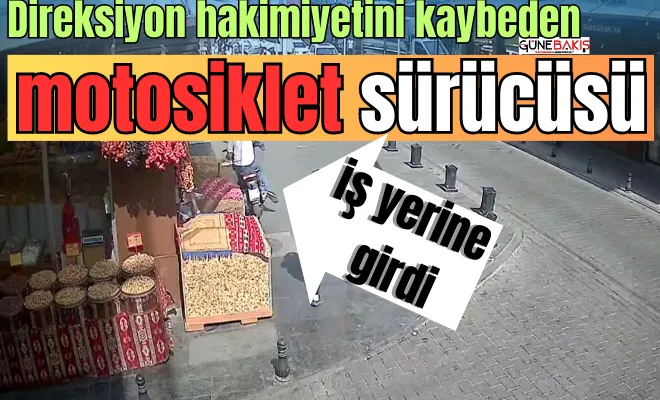 Direksiyon hakimiyetini kaybeden motosiklet sürücüsü iş yerine girdi